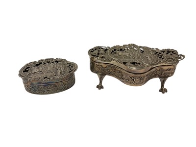 Lot 317 - Two late Victorian silver pot pourri pots by William Comyns