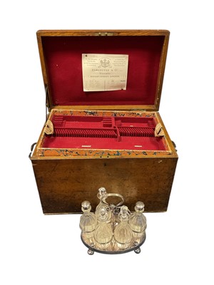 Lot 300 - Victorian Oak travelling canteen, with iron carrying handles and hinged lid, with Elkington trade lable, containing six empty felt lined, lift out trays, fitted for cutlery and a silver plated s...