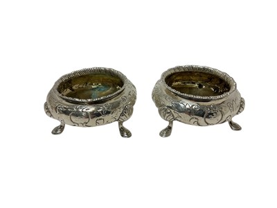 Lot 343 - Pair of Victorian silver salt cellars of cauldron form, with gadrooned borders and gilded interior, each raised on three hoof feet, (London 1856), each 8cm in diameter, all at 6.5ozs.