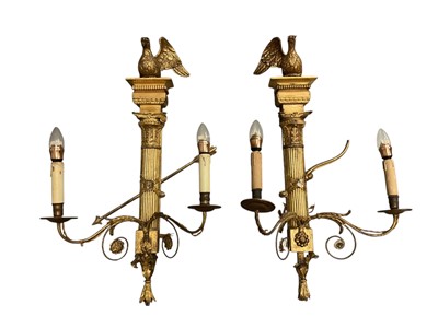 Lot 1503 - Impressive pair of Classical Revival gilt gesso twin brass wall lights, with ho-ho bird surmount raised on classical column, issuing twin scrolling candle arms, 19th century or earlier, 82...