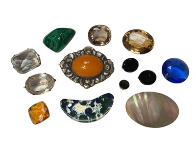 Lot 41 - Collection of unmounted gem stones including malachite, quartz etc, silver mounted amber brooch and an oval mother of pearl plaque brooch