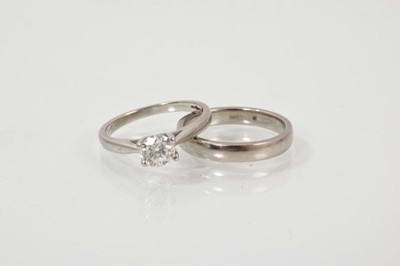 Lot 476 - Diamond single stone ring with a round brilliant cut diamond estimated to weigh approximately 0.50cts in platinum setting, together with a palladium wedding ring (2)