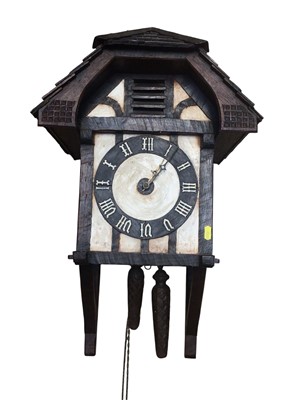Lot 2918 - Unusual early 20th century Black Forest hanging wall clock with 'cottage '- style timber framed case with pitched roof, the twin weight driven movement striking on bell . Two weights and pendulu...