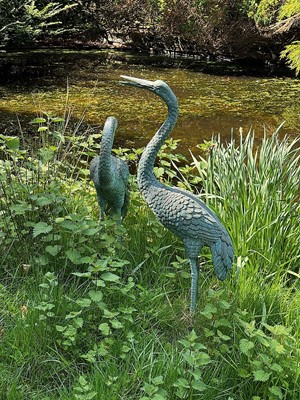 Lot 1473 - Two metal models of storks.