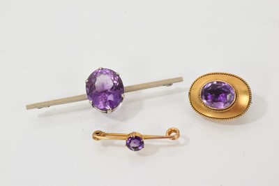 Lot 457 - Three antique gold and amethyst brooches