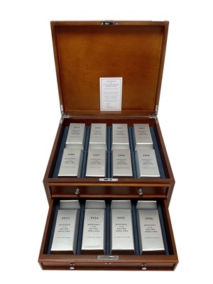 Lot 429 - U.S. - A two drawer wood cabinet containing a Danbury Mint Collection of silver Dollars to include 1879 x 2, 1880 x 2, 1881 x 2, 1883 x 2, 1884 x 2, 1889 x 2, 1890 x 2, 1896 x 2, 1900 x 2, 1901...