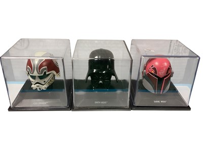 Lot 1811 - Star Wars miniature Helmet Collection including Darth Vader, Boba Fett, Sabine Wren, Ezra Bridger, Imperial Gunner, Resistance Trooper, Coruscant Emergency Crew, Death Star Trooper & Rebel C...