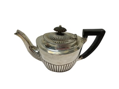 Lot 254 - Early 20th century silver teapot with fluted decoration