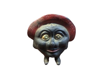 Lot 2933 - Vintage cast iron money box with save and smile money box engraved to the hat