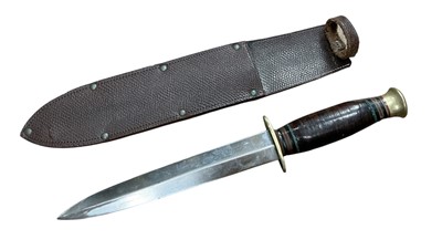 Lot 902 - Second World War period private purchase fighting knife with steel blade stamped 'Taylor Witness, Sheffield, England', with wooden grip in leather sheath, blade 17cm in overall length.