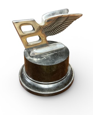 Lot 10 - Bentley Mulsanne-type flying B mascot marked 'Bentley Motors Ltd' on display stand.