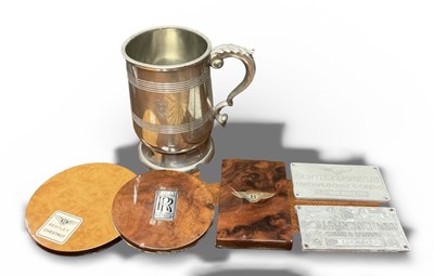 Lot 17 - Rolls-Royce Silver Shadow chassis plate, Bentley T chassis plate, Rolls-Royce pewter mug and wood sample coasters (6)