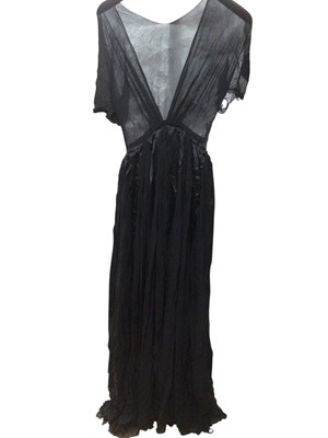 Lot 2502 - Circa 1930s sheer black silk crepe evening gown with black satin ribbon details, 1940s black cocktail dress with a wide shaped waistband plus a strapless (may have had shoe-string straps) black s...