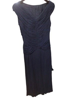 Lot 2503 - Three 1950s dresses including two ruched crepe evening dresses and a red velvet dress with stiffened skirt