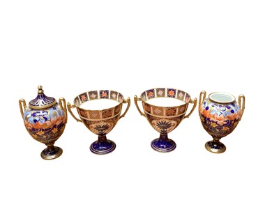 Lot 2227 - Pair of Royal Crown Derby Imari pattern two handled urn shape vases, pattern 1276-1128, 11.5cm high, together with a pair of Edwardian Art Nouveau vases (4)