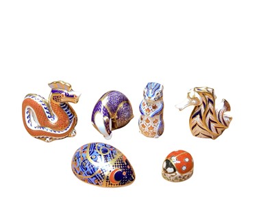 Lot 2210 - Six Royal Crown Derby paperweights including Dragon and Seahorse