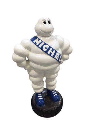 Lot 106 - Large freestanding promotional fibreglass resin figure of Bibendum (the Michelin man), standing on a tyre, approximately 119cm in overall height.