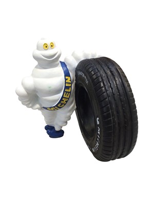 Lot 160 - Bibendum (The Michelin Man), novelty advertising figure, standing with a tyre, 46cm in height.