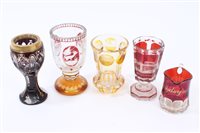 Lot 60 - Three 19th century Bohemian ruby and amber...