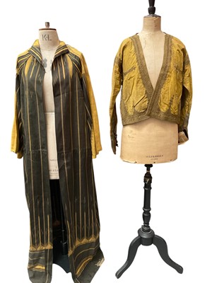 Lot 2510 - Early 1900s Middle Eastern black and gold woven robe in striking geometric design.