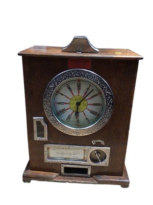 Lot 2955 - Large penny slot machine in a oak case measuring approximately 59cm tall