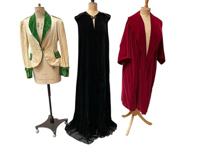 Lot 2519 - Vintage black opera cloak by Peter Jones Sloane Square, J Lewis & Co, button clasp at neck. 150cms length back of collar to hem. Ruby red evening coat with wide collar and wide 3/4 sleeves...