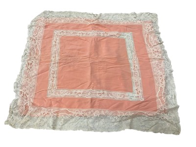 Lot 2523 - 1930s peach bed linen with lace trim consisting of peach bed cover 200 x 360cms, a pair large square pillowcases and plain sheet 200 x 340cms all approximate measurements, cover and pillowc...