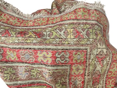 Lot 2530 - Handmade, partially constructed, large tapestry wool rug with a sizable bag of wool skeins in appropriate colours. Plus various lengths and sections of wool tapestry, possibly for reworking i...
