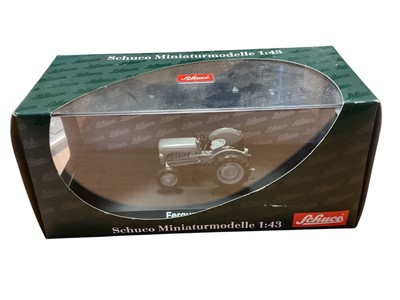 Lot 1715 - Schuco diecast 1:43 Scale Ferguson TE 20 # D-90765 & McCormick D 326 # 03145 Tractors, Oxford 1:76 Scale Combine Harvester # 76CHV001 & JCB 3CX Construction Diggers, in window boxes (5)...