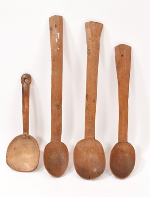 Lot 702 - Four antique Welsh treen hand whittled spoons