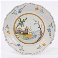 Lot 94 - 18th century French faience plate painted with...