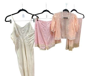 Lot 2552 - Selection of vintage lace-trimmed lingerie and bed jacket, plus Edwardian and later white cotton skirts, petticoats and nighties.