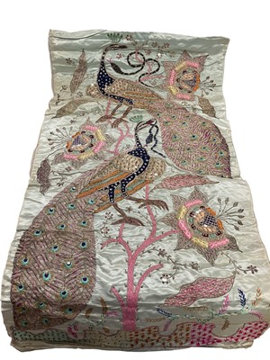Lot 2568 - Three Indian silk embroidered panels design including peacock with snake in coloured threads, metallic threads and sequins.