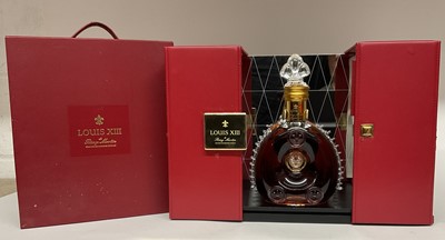 Lot 47 - Remy Martin Louis XIII Grande Champagne Cognac, in fitted presentation box, with mirror back display case. The Baccarat crystal decanter with additional stopper