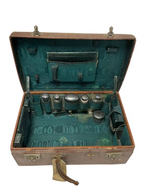Lot 231 - Leather vanity case containing silver mounted fittings