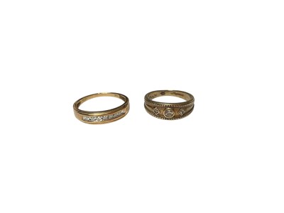 Lot 60 - 9ct gold diamond set half eternity ring and 9ct gold diamond three stone ring (2)