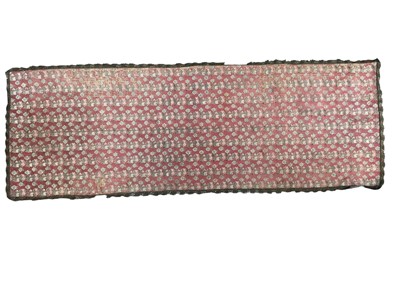 Lot 2584 - 19th century woven silk wall hanging in a small floral chintz design with scalloped metallic thread edging. 140cms x 50cms.
