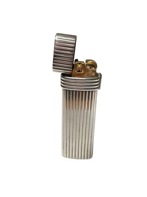 Lot 29 - Christian Dior silver plated lighter with reeded decoration, 7cm