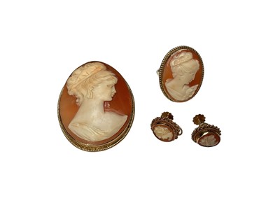 Lot 134 - 9ct gold mounted carved shell cameo brooch / pendant depicting a classical female bust, together with a similar yellow metal ring and pair of 9ct gold screw back earrings