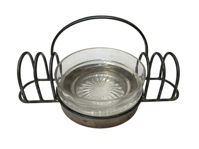 Lot 181 - George V silver toast rack / preserve stand with a central glass liner, (Birmingham 1931), maker Asprey and Co, approximately 16.5cm in overall length.