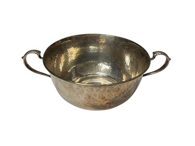 Lot 127 - Edwardian silver two handled bowl with planished decoration, (London 1905), maker Mappin & Webb, 16.5cm in diameter.