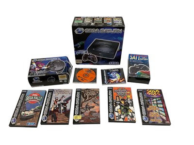 Lot 2713 - Boxed Sega Saturn with controller and manual, together with a boxed 3D control pad and seven games.