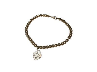 Lot 84 - Tiffany & Co silver bracelet with silver beads and heart shape tag