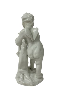 Lot 5010 - White glazed figure of Cupid