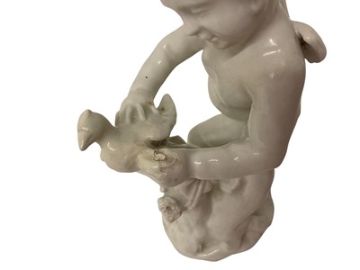 Lot 5010 - White glazed figure of Cupid