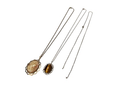 Lot 113 - 9ct gold mounted cameo pendant on chain, 9ct gold mounted tiger's eye cabochon on 9ct gold chain and one other 9ct gold chain