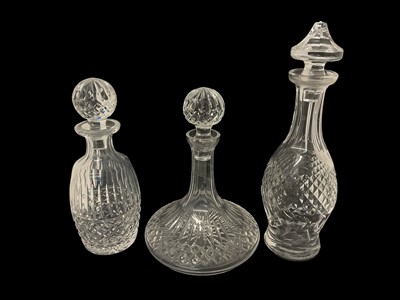 Lot 105 - Three cut glass decanters