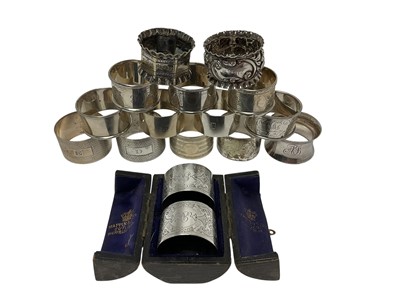 Lot 207 - Cased pair of napkin rings and fourteen other napkin rings