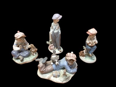 Lot 2230 - Four Lladro porcelain figures including three of children with dogs
