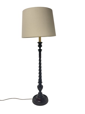 Lot 831 - Elegant Georgian style turned mahogany candlestick converted for electricity